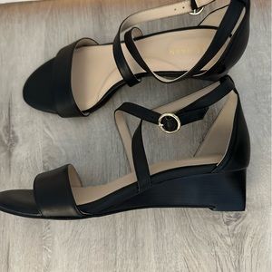 Women’s size 7 black Cole Haan criss-cross sandals with a tiny heel.